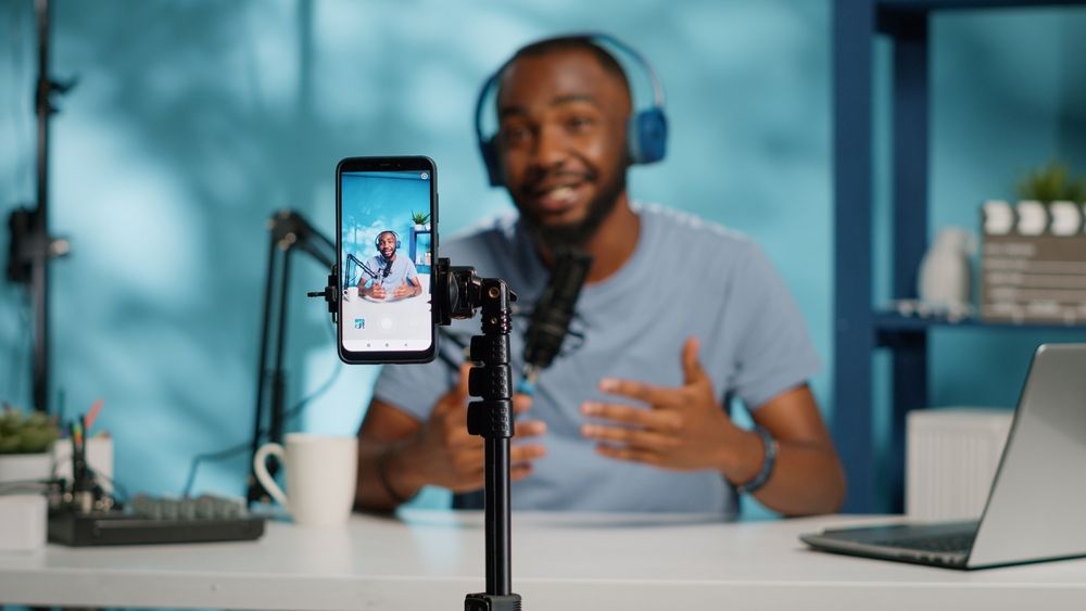 Creator filming a podcast on a mobile device